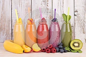 Fruit smoothies variety in rainbow colors with fresh photo