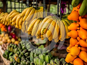 Fruit stand selling bananas and other tropical fruits