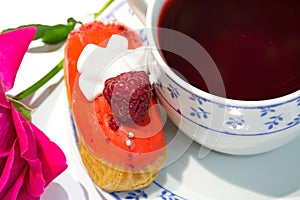 Fruit strawberry eclair cake with hibiscus tea Sudan rose tea