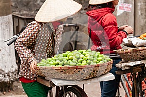 Fruit street vendors with bicycles on the street of Lao Kai, Vie photo