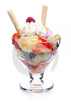Fruit sundae with whipped cream and ice cream cones