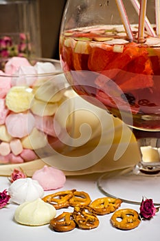 Fruit sungria party big glass, lots of straws on table