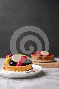 fruit tart dessert with white chocolate and cream