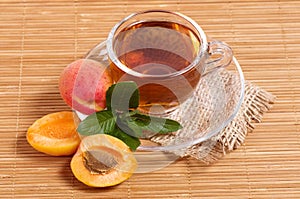 Fruit tea in cup with apricot