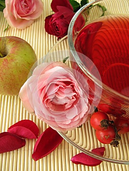 Fruit tea with rose hips, apples and rose flowers