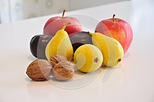 Fruit varies on kitchen table photo