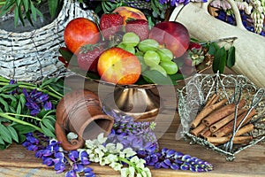 Fruit vase copper with peaches , green grapes and red strawberries