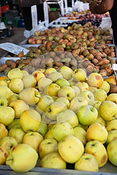 Fruit and vegetable market in Spain. Apples and pears sold on outdoor market. Ripe spanish fruits