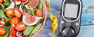 Fruit and vegetable salad and glucometer with tape measure, concept of diabetes, slimming and healthy nutrition