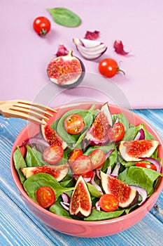 Fruit and vegetable salad with wooden fork, concept of healthy lifestyle and nutrition