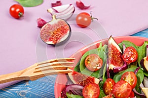 Fruit and vegetable salad with wooden fork, concept of healthy lifestyle and nutrition