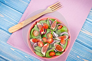 Fruit and vegetable salad with wooden fork, concept of healthy lifestyle and nutrition