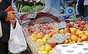 A fruit vendor\'s booth in Armenia filled with colorful fruit
