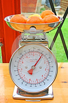 Fruit on weighing scales.