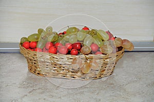 Fruit in a wicker basket for the table .Grape.