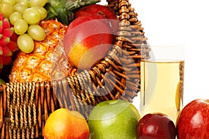 Fruits in basket and juice.