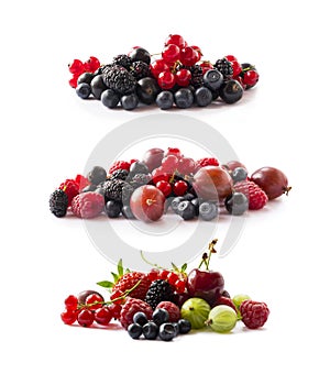 Fruits, berries isolated on white background. Fruits and berries with copy space for text. Currant, blueberry, strawberry, cherry