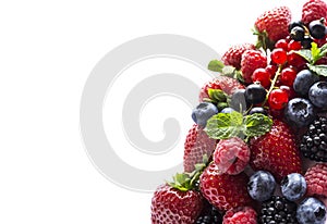 Fruits and berries isolated on white background. Ripe currants, raspberries, blueberries, strawberries and blackberries with a mi