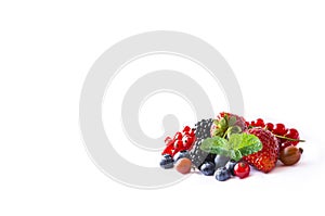 Fruits and berries isolated on white background. Ripe red currants, blackberries, blueberries, strawberries and gooseberry with a