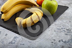 Fruits on a black slate board