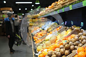 Fruits. Blurred image of supermarket.