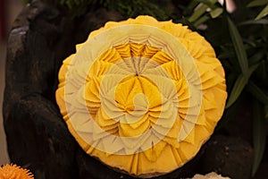 Fruits are carved into beautiful flower shapes.