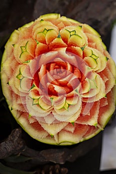 Fruits are carved into beautiful flower shapes.