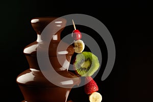 Fruits in chocolate fountain