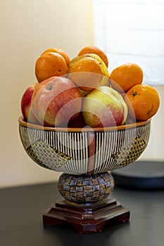 Fruits in a deorative bowl.