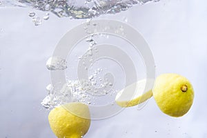 fruits dropped into water and splashing water