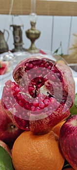 Fruits and fresh red seeded pomegranates.