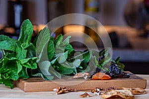 Fruits and kitchen herbs still life in the kitchen