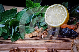 Fruits and kitchen herbs still life in the kitchen