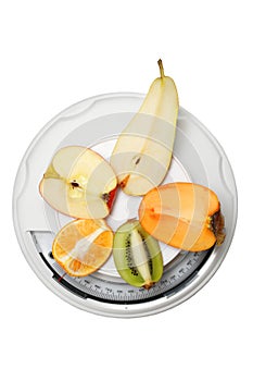 Fruits on kitchen scales