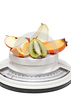 Fruits on kitchen scales