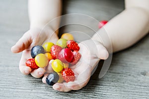 Fruits in little child hands - kid