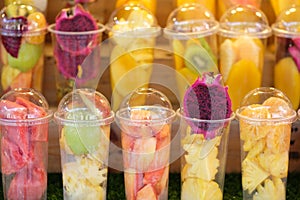 Fruits in the plastic cup for mix as juice - soft focus