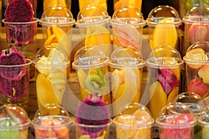 Fruits in the plastic cup for mix as juice - soft focus