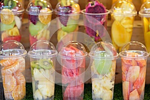 Fruits in the plastic cup for mix as juice - soft focus