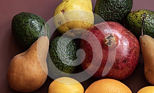 Fruits with pomegranate, pears, oranges and avocados