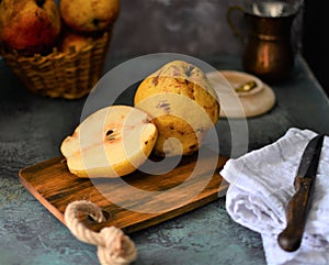 fruits on the retro table, quince in the basket