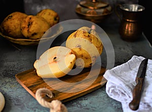 fruits on the retro table, quince in the basket