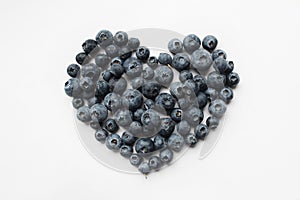 Fruits - shape of a heart, bilberries on a white background.