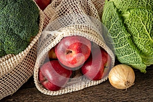 Fruits and vegetables in ecological reusable mesh bags made of organic cotton - zero-waste concept