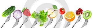 Fruits and vegetables on the forks. Healthy food