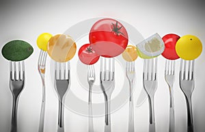 Fruits and vegetables on the forks. Healthy food