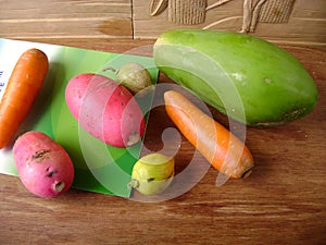 Colorful carrot, lemon, red skin radish and melon