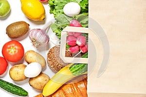 Fruits, vegetables and products in a paper grocery bag