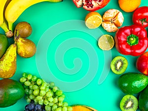 Fruits and vegetables rich in antioxidants, vitamin and fiber on trendy mint green background. Flat lay style. Super food