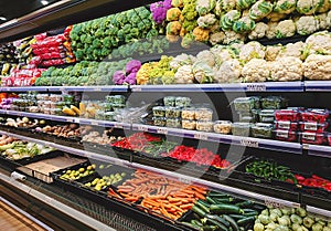 Fruits and vegetables on shop stand in supermarket grocery store